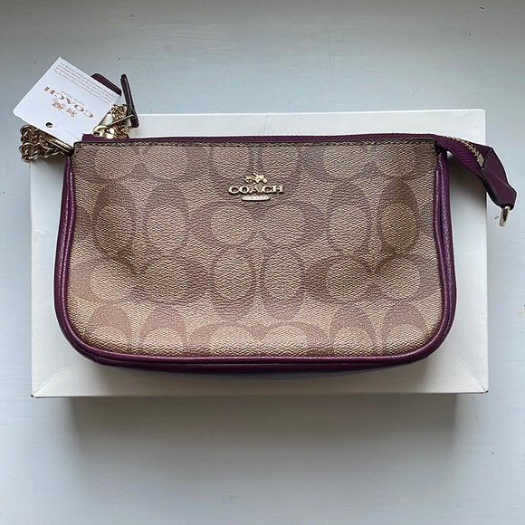 Coach Handbags - Coach Wristlet in plum.